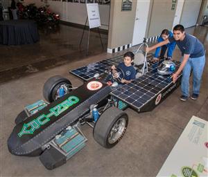 Students with solar electric car 
